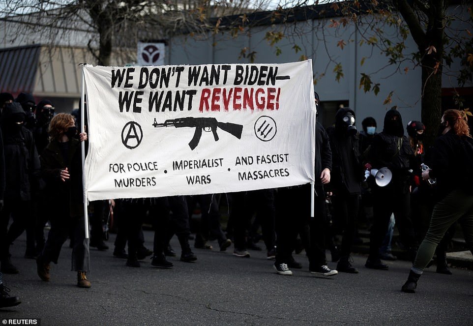38285232-9170237-OREGON_One_of_the_signs_read_We_don_t_want_Biden_we_want_revenge-a-2_1611241910768.jpg