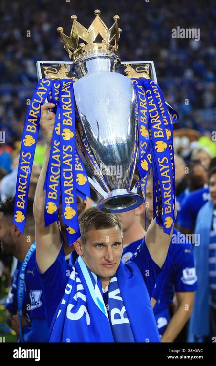 leicester-citys-marc-albrighton-lifts-the-trophy-as-the-team-celebrate-G8XGWC.jpg