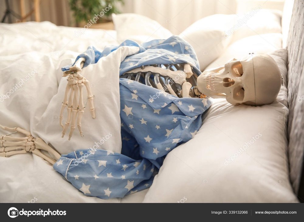 depositphotos_339132066-stock-photo-human-skeleton-pajamas-lying-bed.jpg